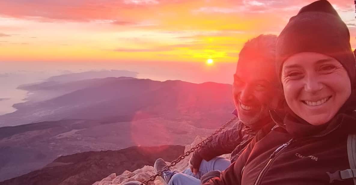 Hiker approaching the summit of Mount Teide with panoramic views across Tenerife