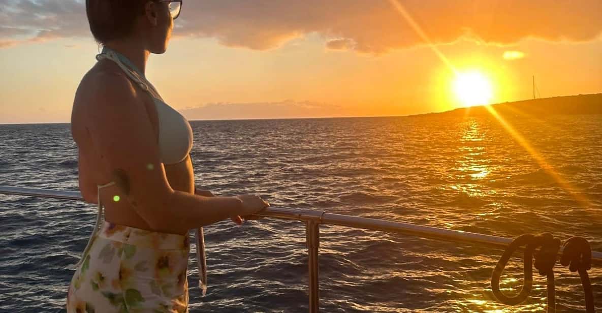 Sailing yacht cruising into a spectacular sunset off the Tenerife coastline